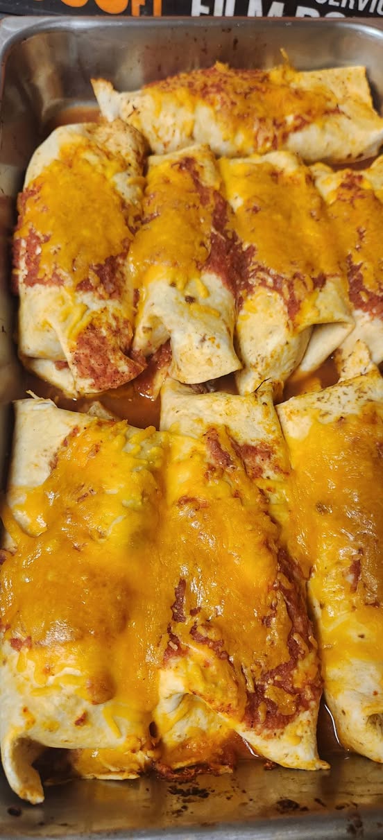 A tray of fresh enchiladas made for to-go meals