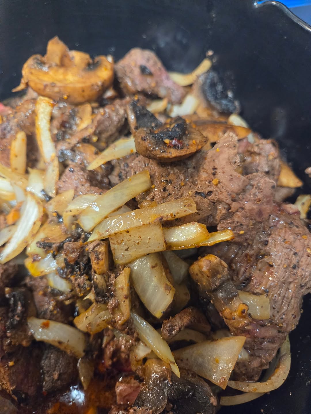 Beef filet tips cooked with onions and mushrooms